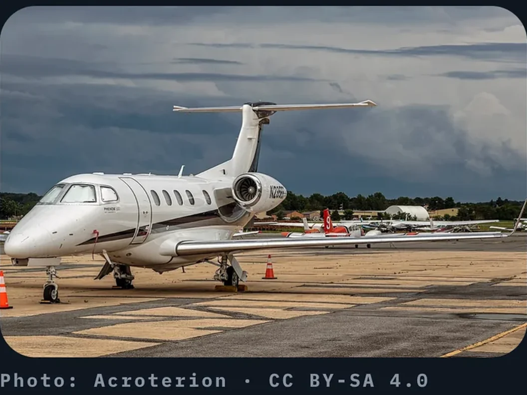 A business jet parked on the ramp under a stormy sky, the photo on a Pilotage flash card